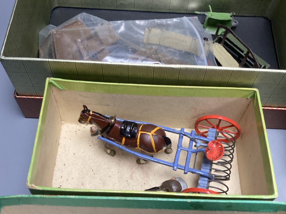 A collection of Britains painted lead farm figures and animals,